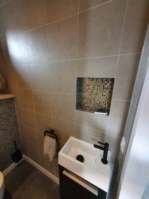 Mozaiek tegels in het toilet
